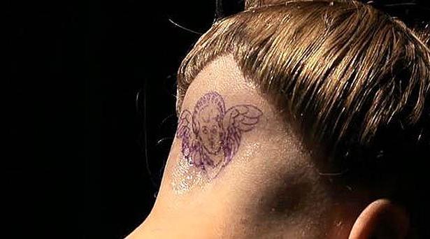 Lady Gaga Sleeps and Gets Tattoo at Fame Perfume Party