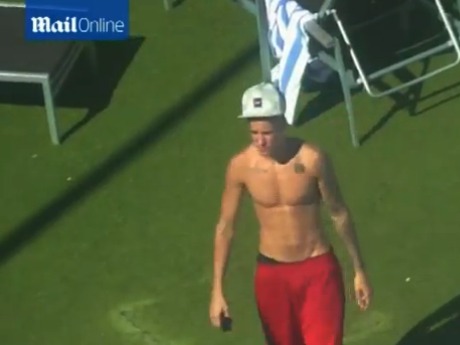 justin bieber tans six pack checks out topless blonde justin bieber tans six pack checks out topless blonde